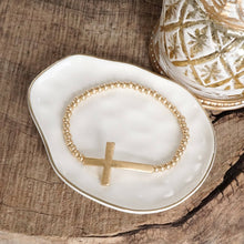 Load image into Gallery viewer, Minimal Cross Stretchy Bracelet in Worn Gold tone with Ball Beads
